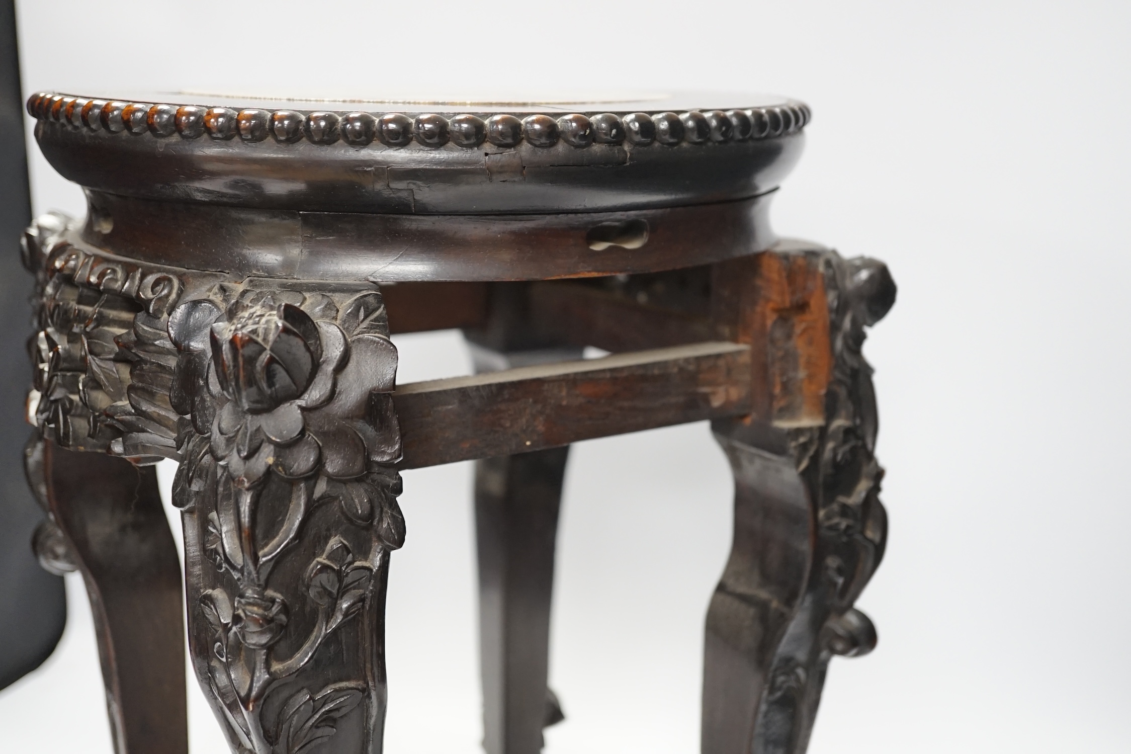 A Chinese hongmu stand, with inset marble top, 42cm high. Condition - poor to fair, section of frieze missing